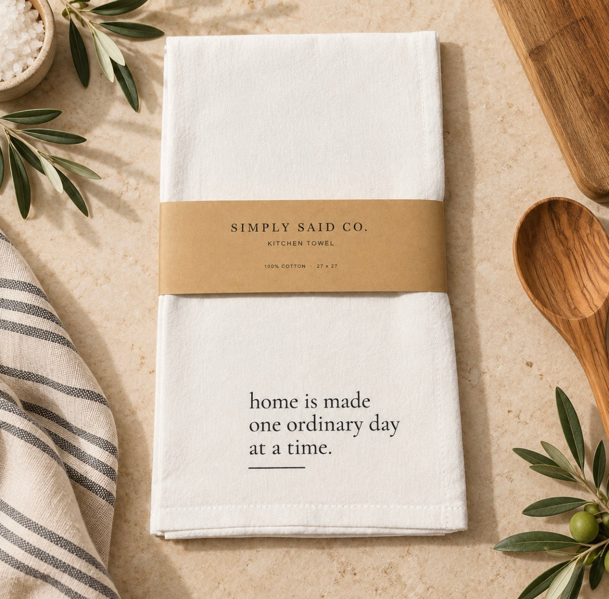 Home Is Made white cotton kitchen towel with Simply Said Co. kraft belly band.
