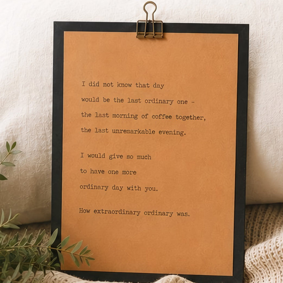 Meaningful grief and loss wood sign with black border and kraft paper design styled with greenery and neutral textiles
