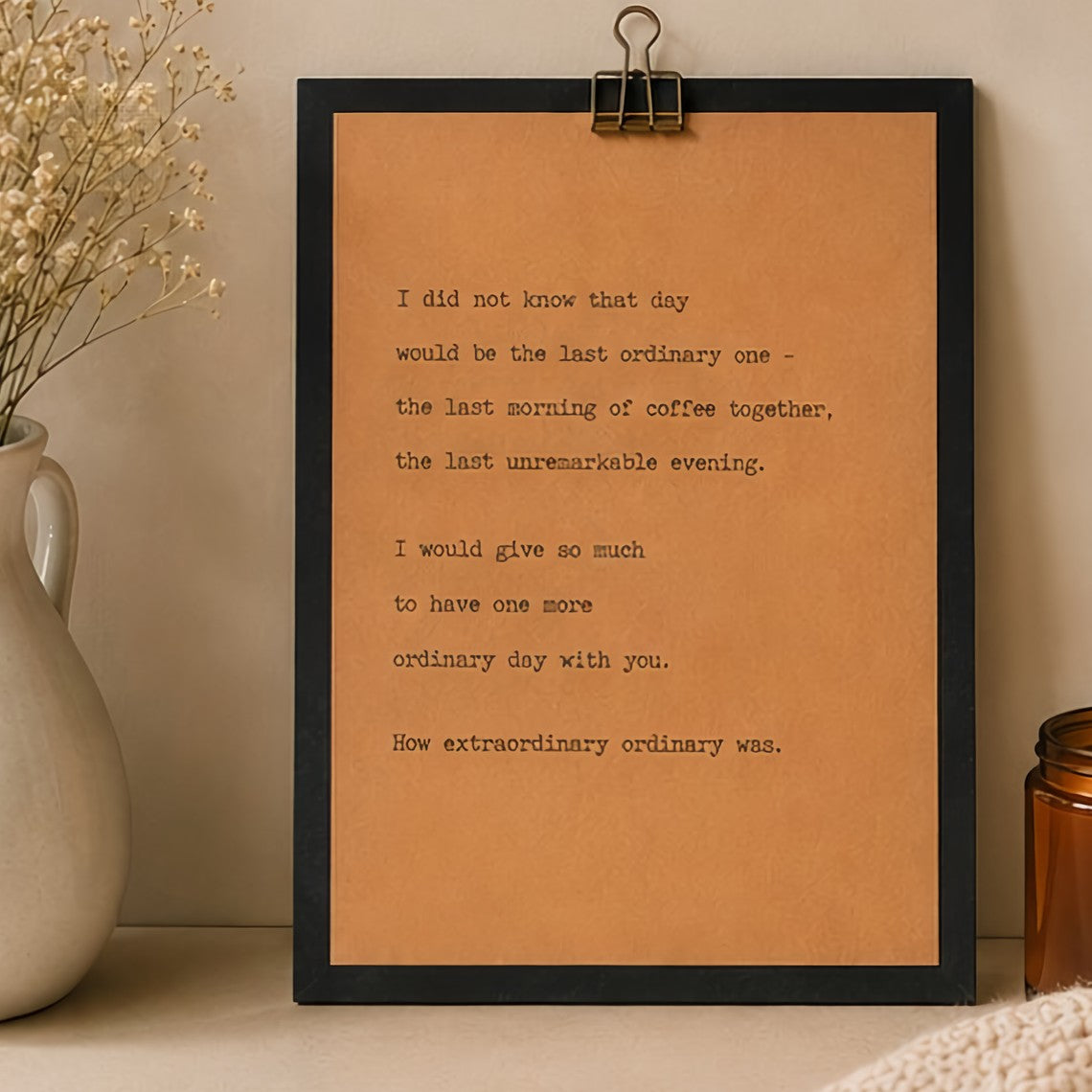 Memorial quote wood sign featuring words about missing ordinary days styled with a neutral vase and amber candle