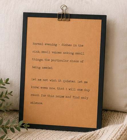 Minimal motherhood wood sign featuring a heartfelt quote displayed with neutral pillows, greenery, and a knit blanket
