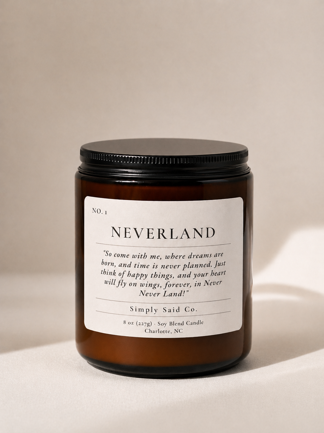 Neverland Candle in amber jar with Peter Pan quote