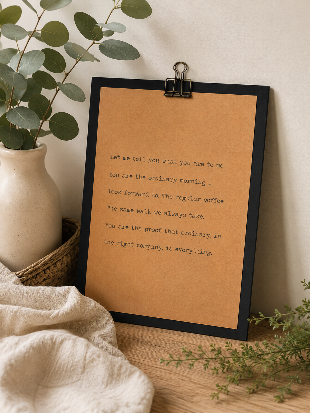 9x12 wood quote sign with black border and kraft paper design styled with dried florals in a neutral home setting.