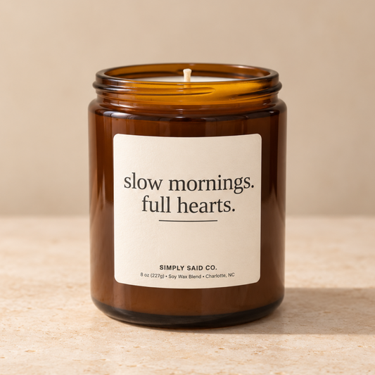 8 oz amber glass quote candle with Slow Mornings Full Hearts label